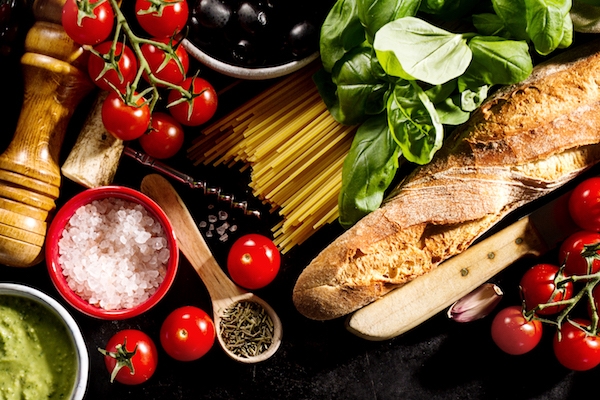 Tasty fresh appetizing italian food ingredients on dark background. Ready to cook. Home Italian Healthy Food Cooking Concept. Toning.